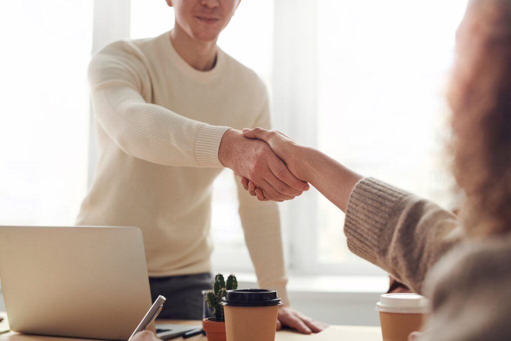 man and woman shaking hands